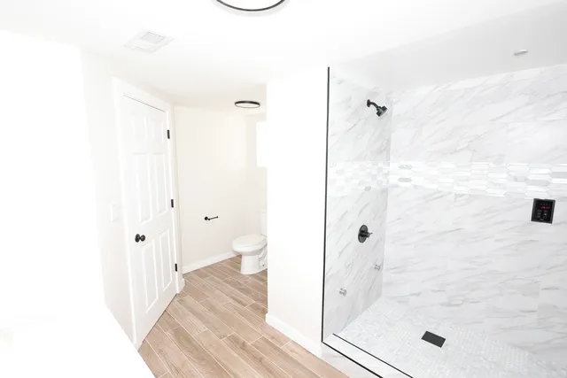 a bathroom with a bathtub and a shower