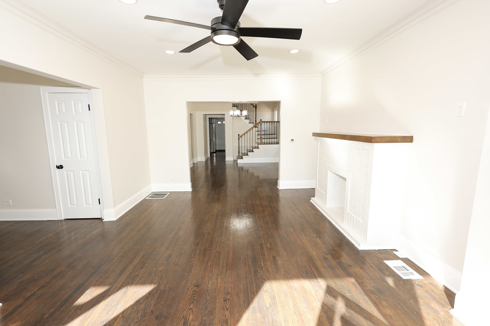 1724 West 105th Street Chicago, IL 60643 - Photo 3 of 34 a view of a hallway with wooden floor