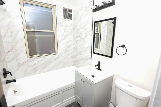 a bathroom with a sink and a toilet