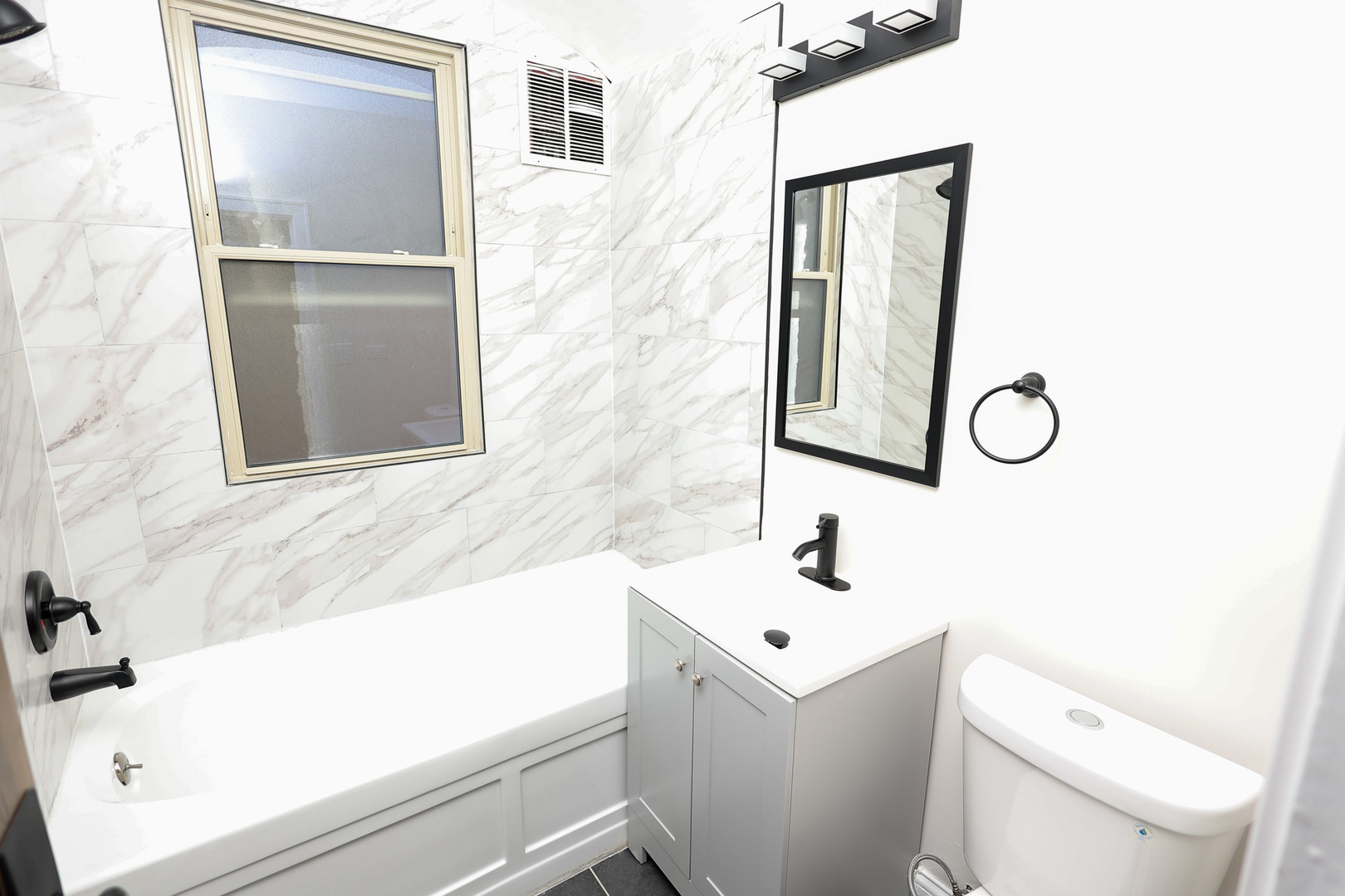 1724 West 105th Street Chicago, IL 60643 - Photo 8 of 34 a bathroom with a sink and a toilet