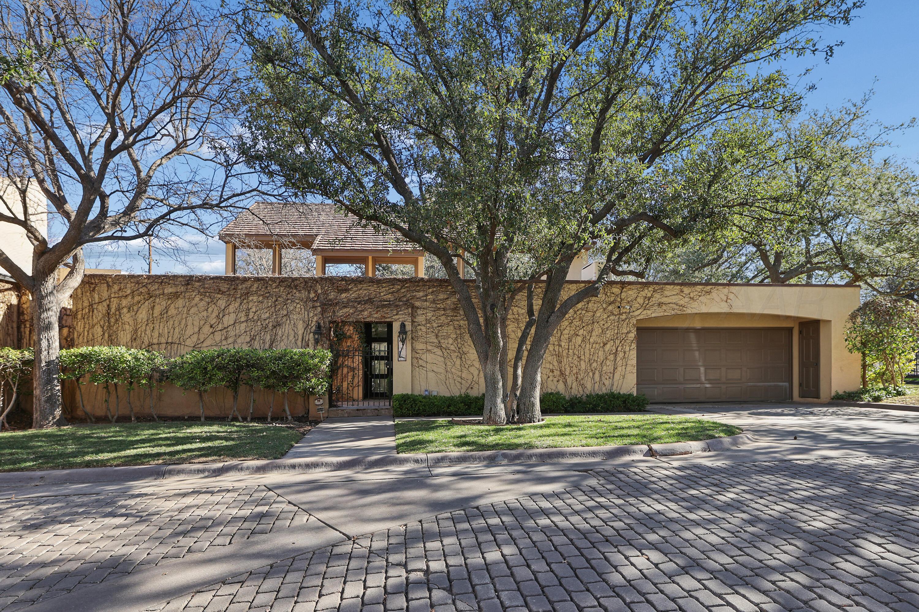 2 Woodstone Street Amarillo, TX 79106 - Photo 1 of 34 a front view of a house with a yard and garage