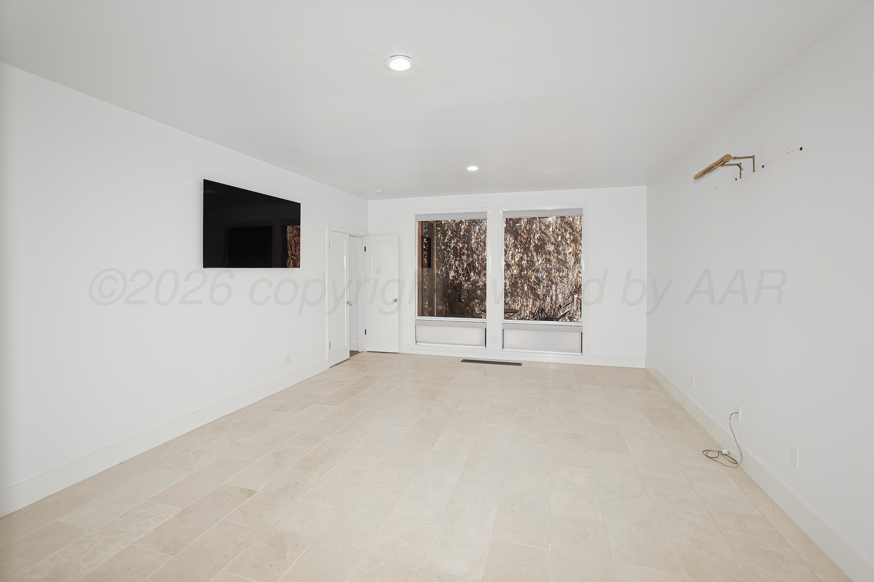 2 Woodstone Street Amarillo, TX 79106 - Photo 15 of 34 an empty room with windows and fireplace