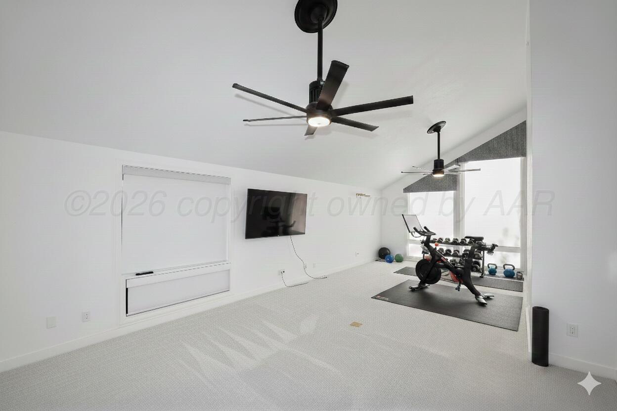 2 Woodstone Street Amarillo, TX 79106 - Photo 21 of 34 a living room with furniture and a flat screen tv