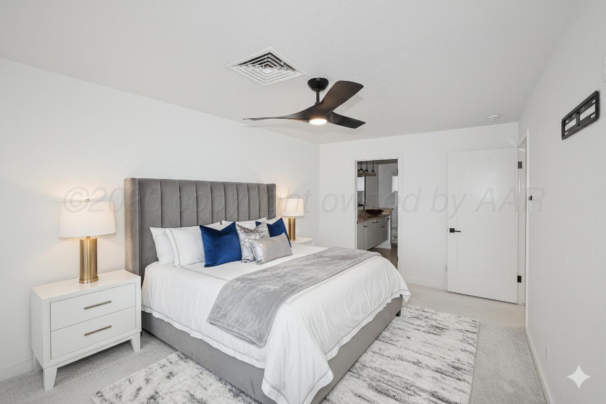 2 Woodstone Street Amarillo, TX 79106 - Photo 23 of 34 a bedroom with a bed and a ceiling fan