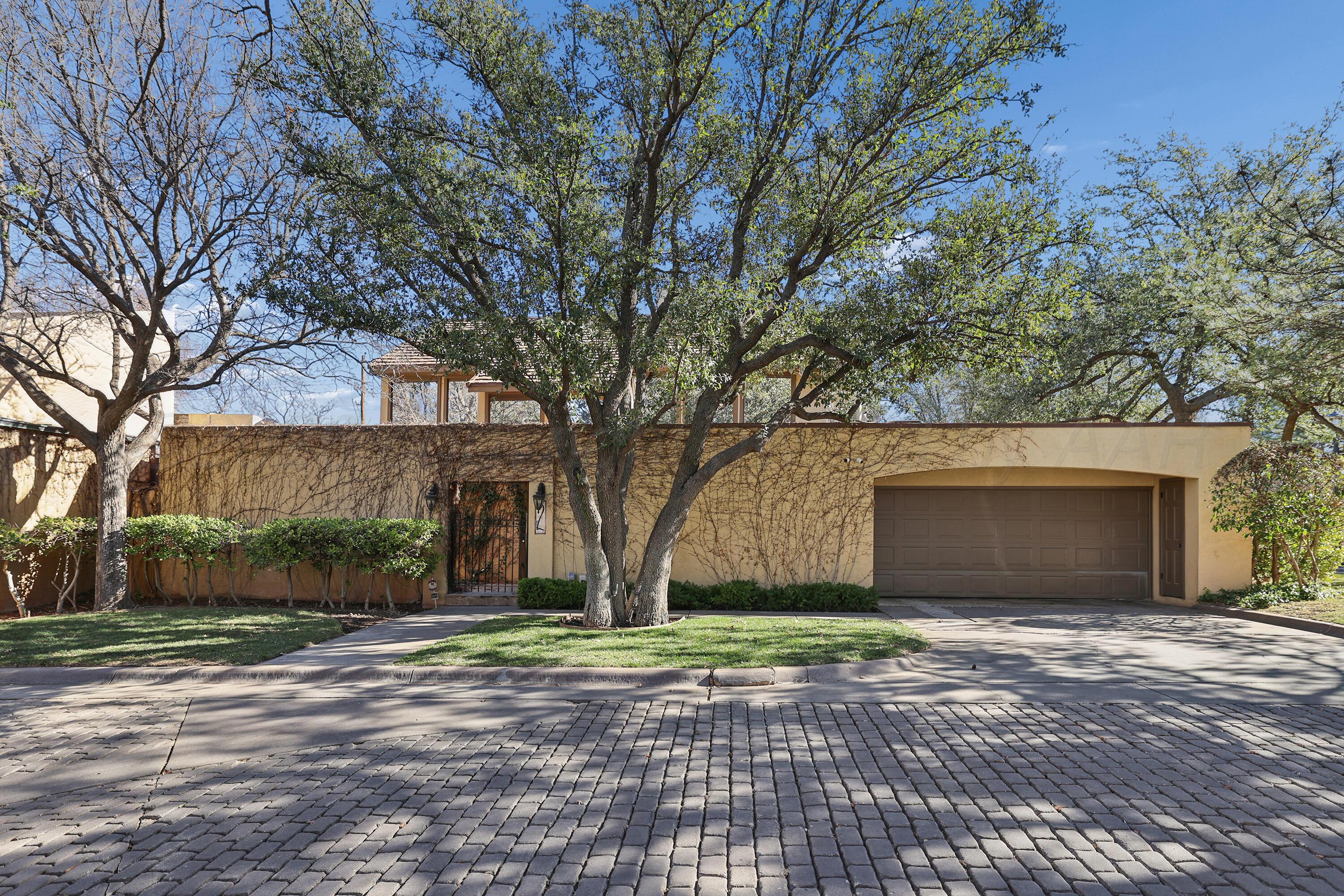2 Woodstone Street Amarillo, TX 79106 - Photo 34 of 34 a front view of a house with a yard and garage