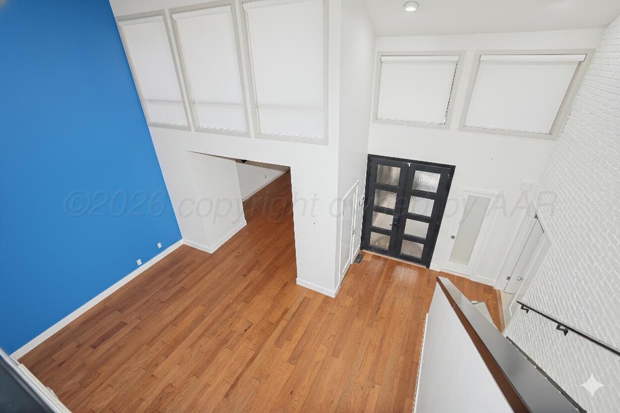 2 Woodstone Street Amarillo, TX 79106 - Photo 4 of 34 a view of a hallway with wooden floor and staircase