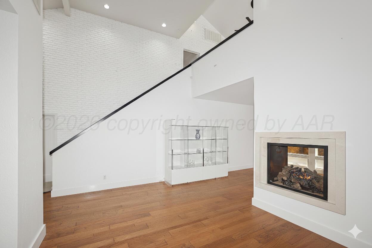 2 Woodstone Street Amarillo, TX 79106 - Photo 5 of 34 an empty room with windows and fireplace