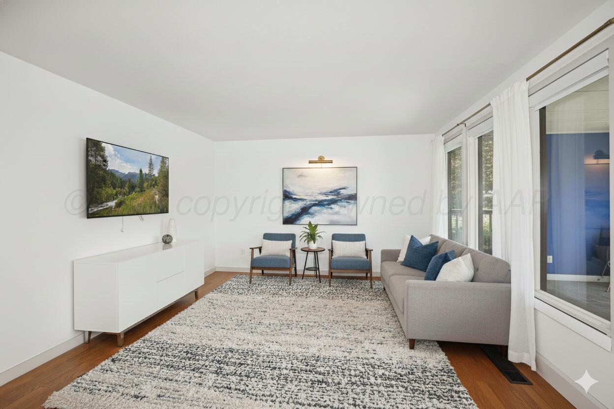 2 Woodstone Street Amarillo, TX 79106 - Photo 6 of 34 a living room with furniture and a flat screen tv