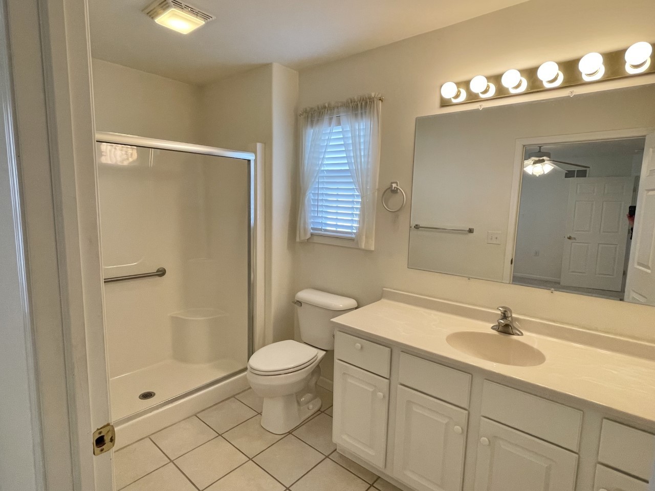 3219 Becker Drive Peru, IL 61354 - Photo 14 of 17 a bathroom with a sink a toilet and shower