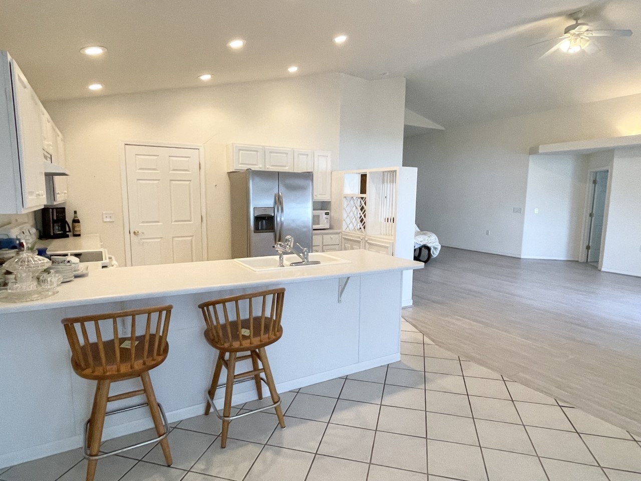 3219 Becker Drive Peru, IL 61354 - Photo 7 of 17 a spacious kitchen with a sink and chairs