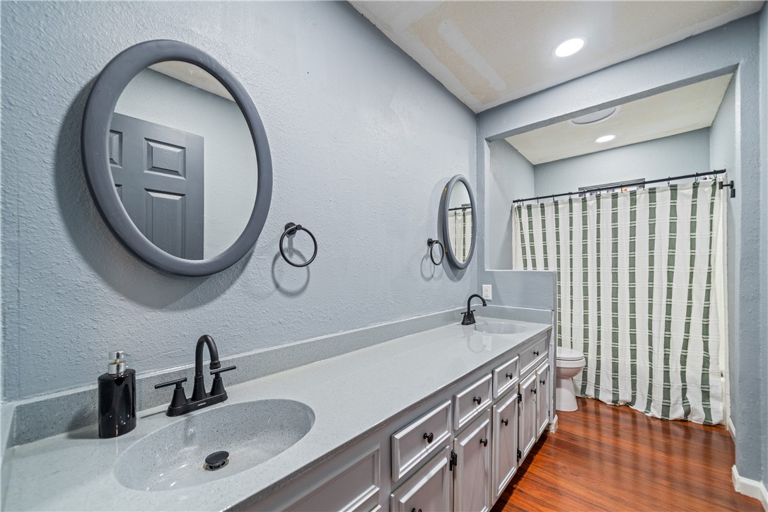 2217 Post Oak Drive Portland, TX 78374 - Photo 25 of 39 a bathroom with a double vanity sink and a mirror