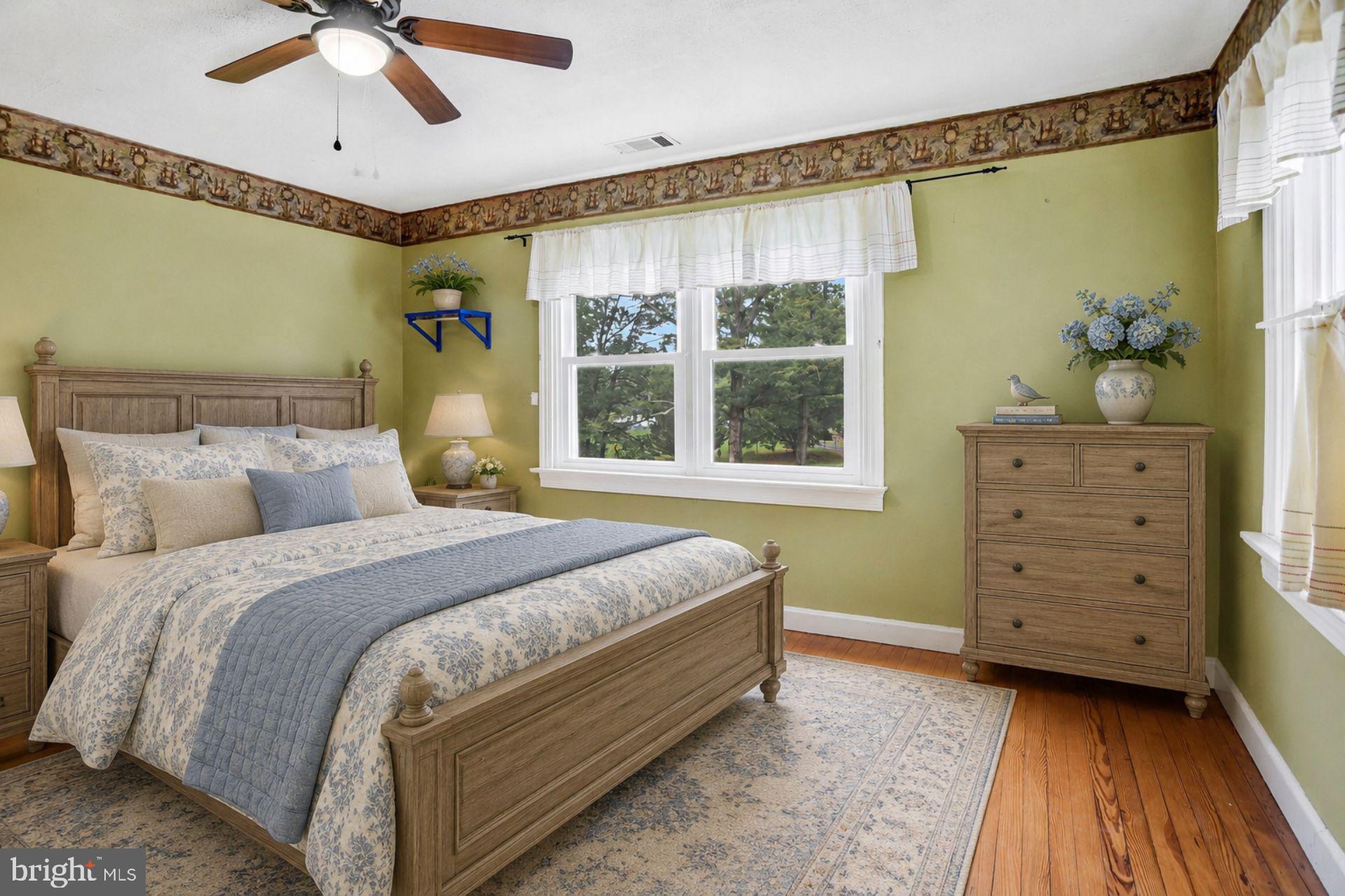 8965 Poorhouse Road Port Tobacco, MD 20677 - Photo 8 of 18 a bed room with a bed and a window