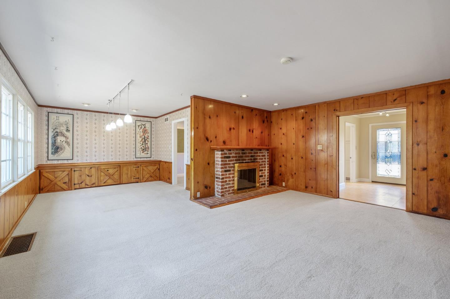 708 Johnston Street Half Moon Bay, CA 94019 - Photo 11 of 41 a view of an empty room with a fireplace and a window