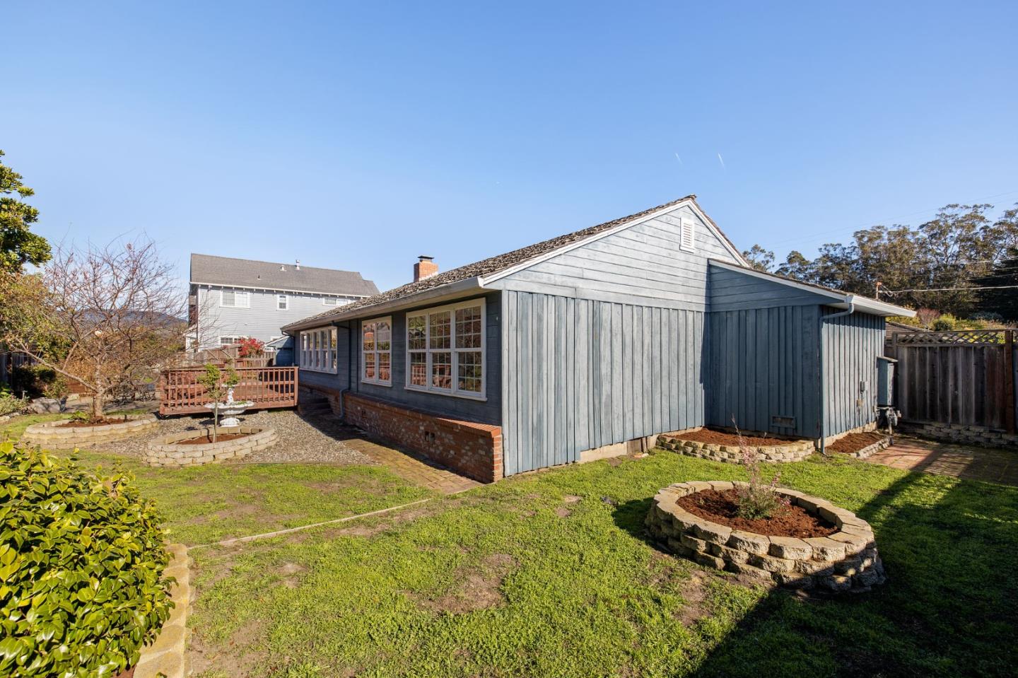 708 Johnston Street Half Moon Bay, CA 94019 - Photo 17 of 41 a backyard of a house with yard and outdoor seating