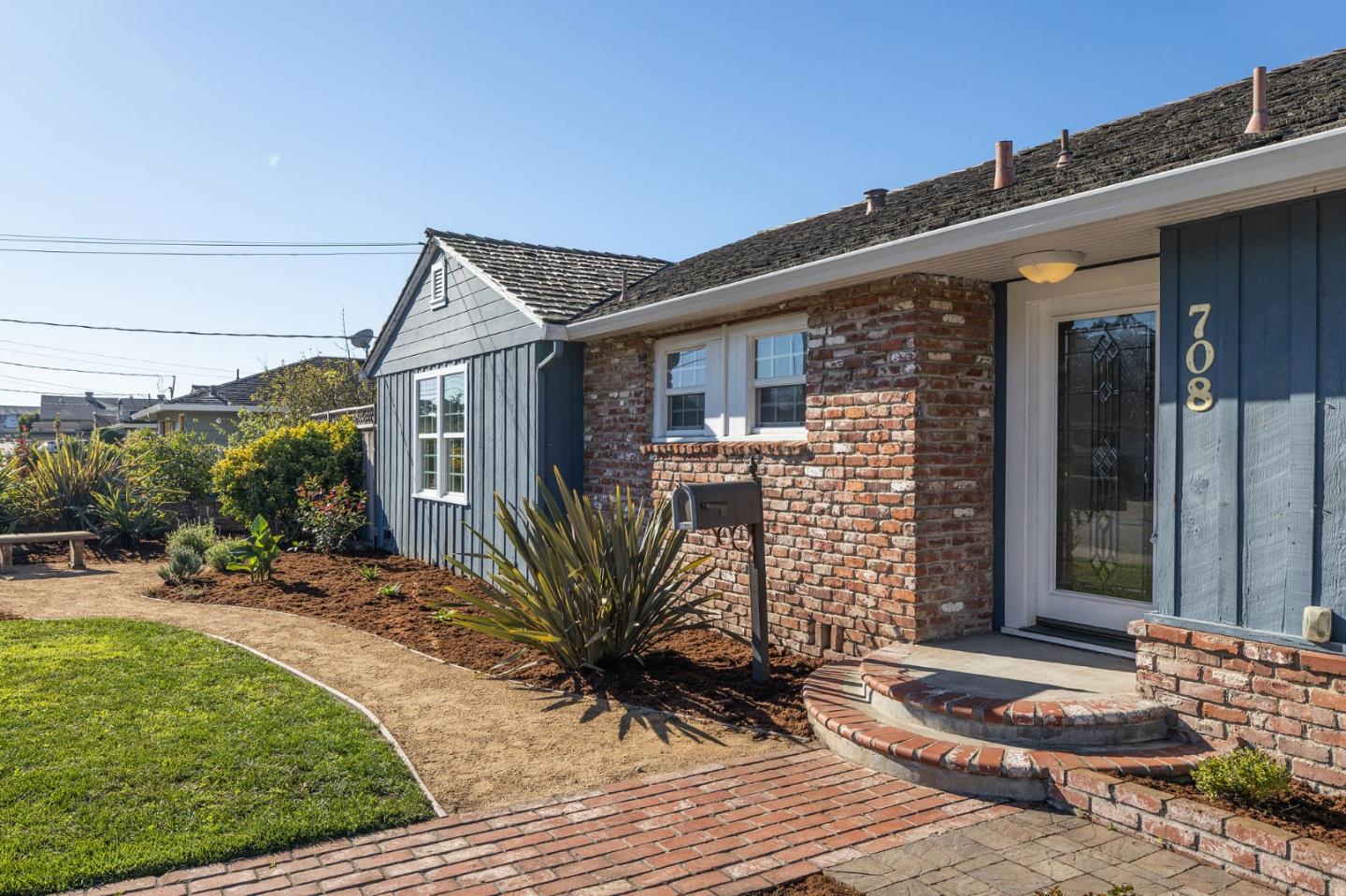 708 Johnston Street Half Moon Bay, CA 94019 - Photo 3 of 41 a front view of a house with garden