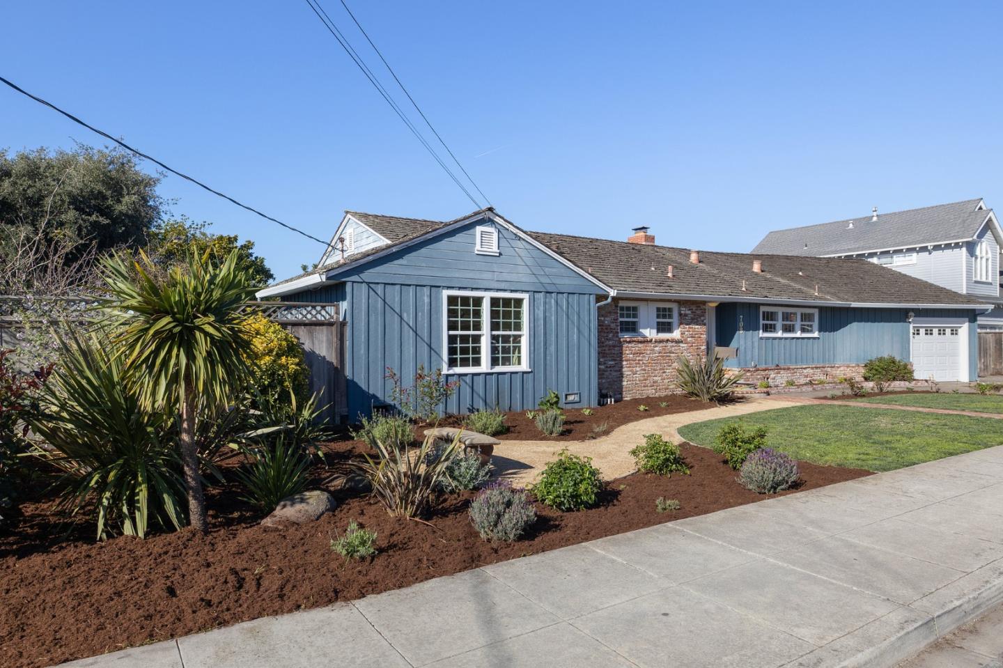 708 Johnston Street Half Moon Bay, CA 94019 - Photo 31 of 41 a front view of a house with a garden