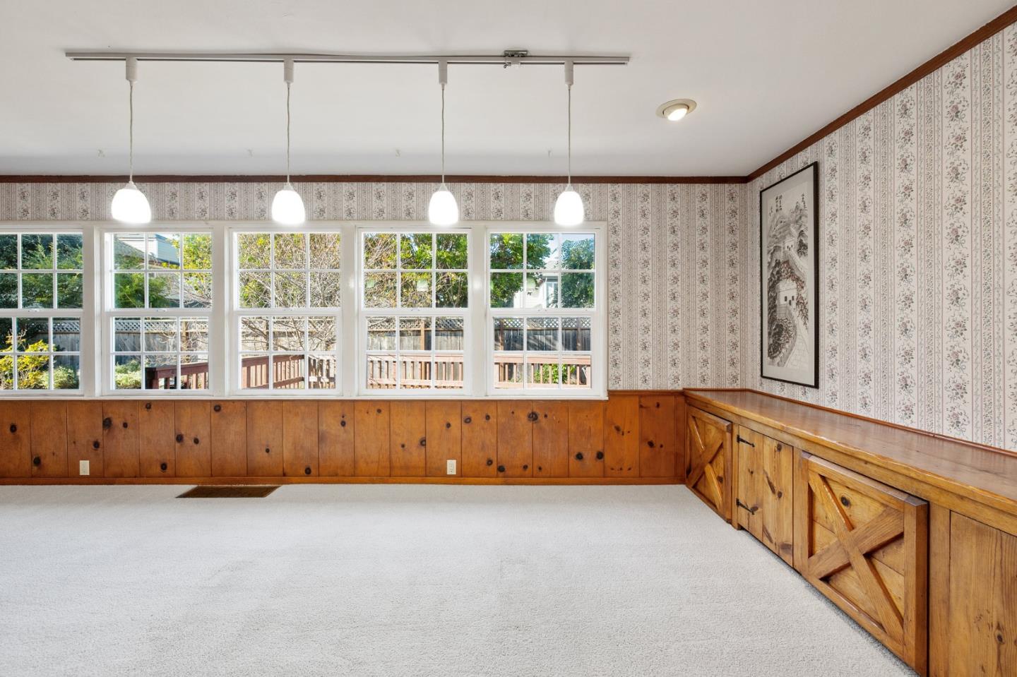 708 Johnston Street Half Moon Bay, CA 94019 - Photo 36 of 41 an empty room with wooden floor and windows