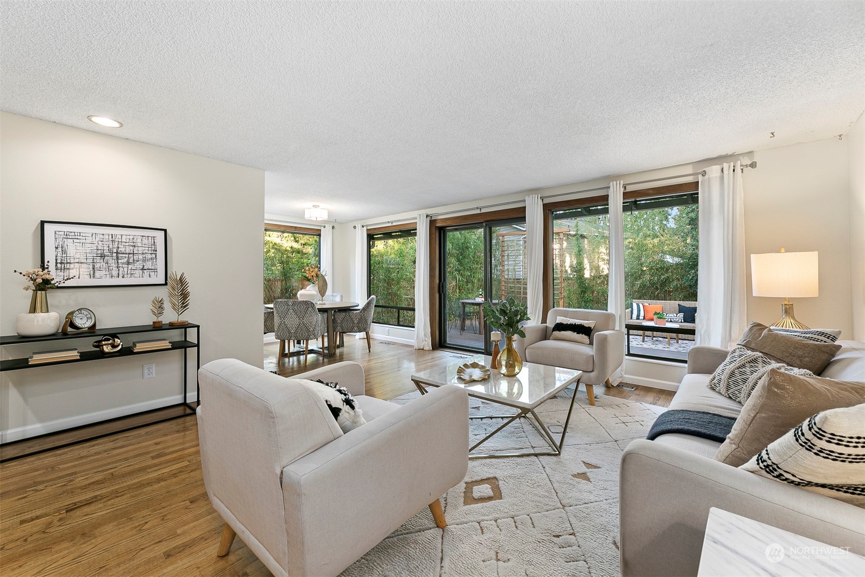 16611 Southeast 147th Street Renton, WA 98059 - Photo 3 of 32 a living room with furniture and floor to ceiling windows