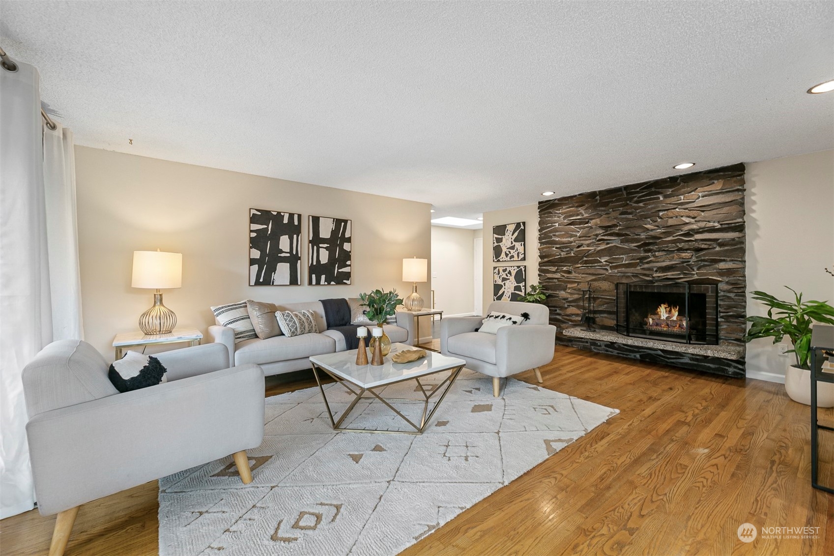 16611 Southeast 147th Street Renton, WA 98059 - Photo 4 of 32 a living room with furniture and a fireplace