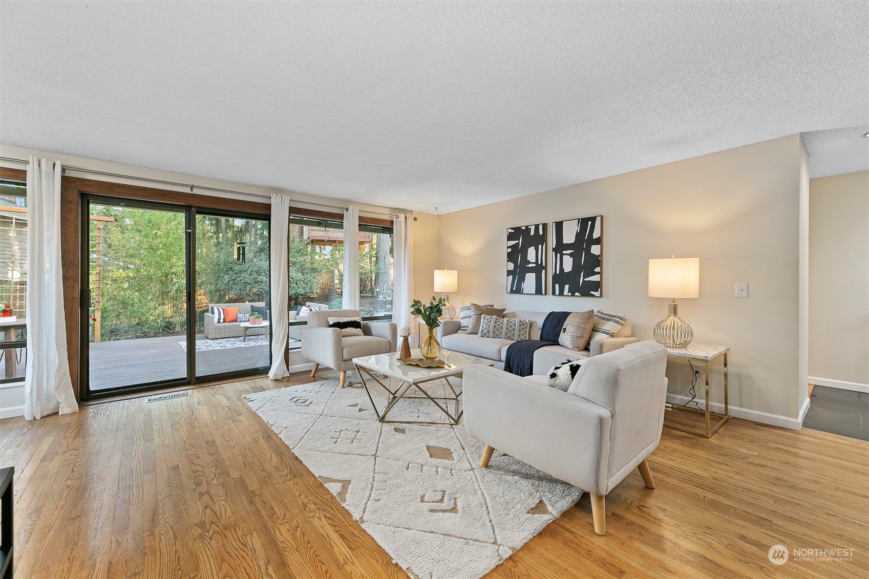 16611 Southeast 147th Street Renton, WA 98059 - Photo 5 of 32 a living room with furniture and large windows