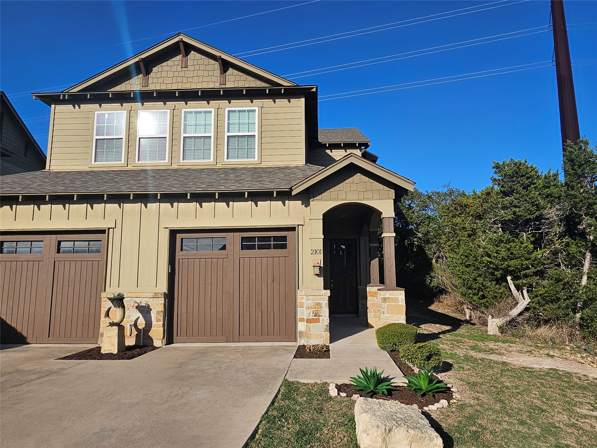 4301 Mansfield Dam Road, Unit 2101 Austin, TX 78734 - Photo 39 of 40 a front view of a house with garden