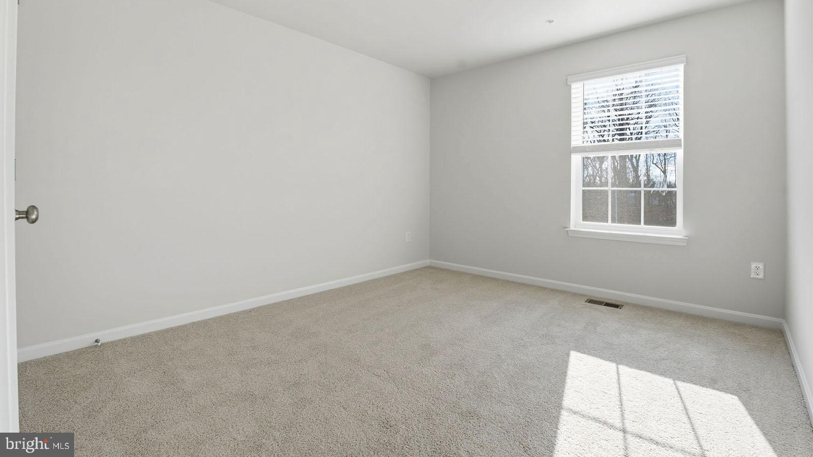 8110 Cypress Pt Drive Rosedale, MD 21237 - Photo 20 of 37 an empty room with a window
