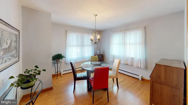 a view of a room with window and wooden floor