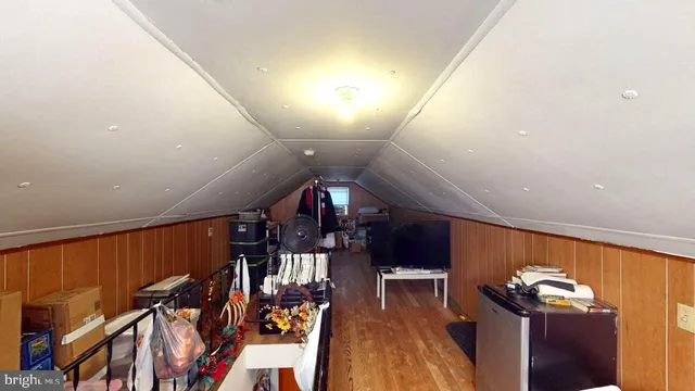 a view of a livingroom with furniture and a window
