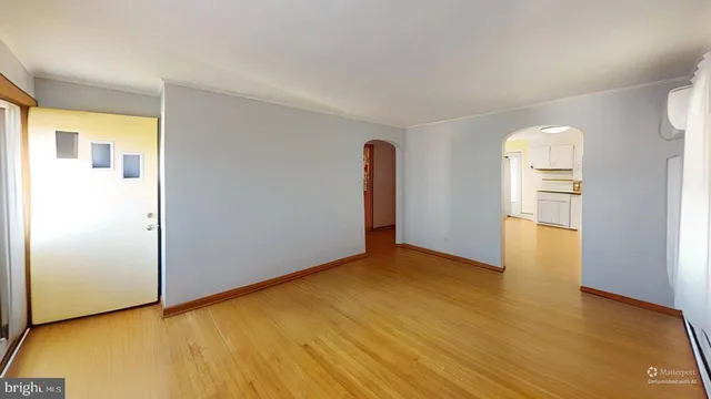 a kitchen with a refrigerator and a sink