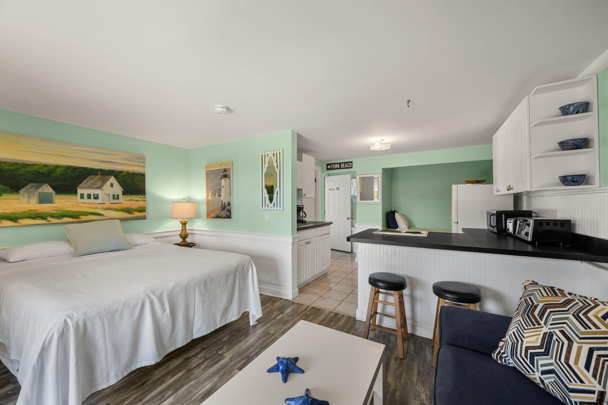 132 Shore Road, Unit 13 Truro, MA 02666 - Photo 12 of 21 a bedroom with double bed and a couch