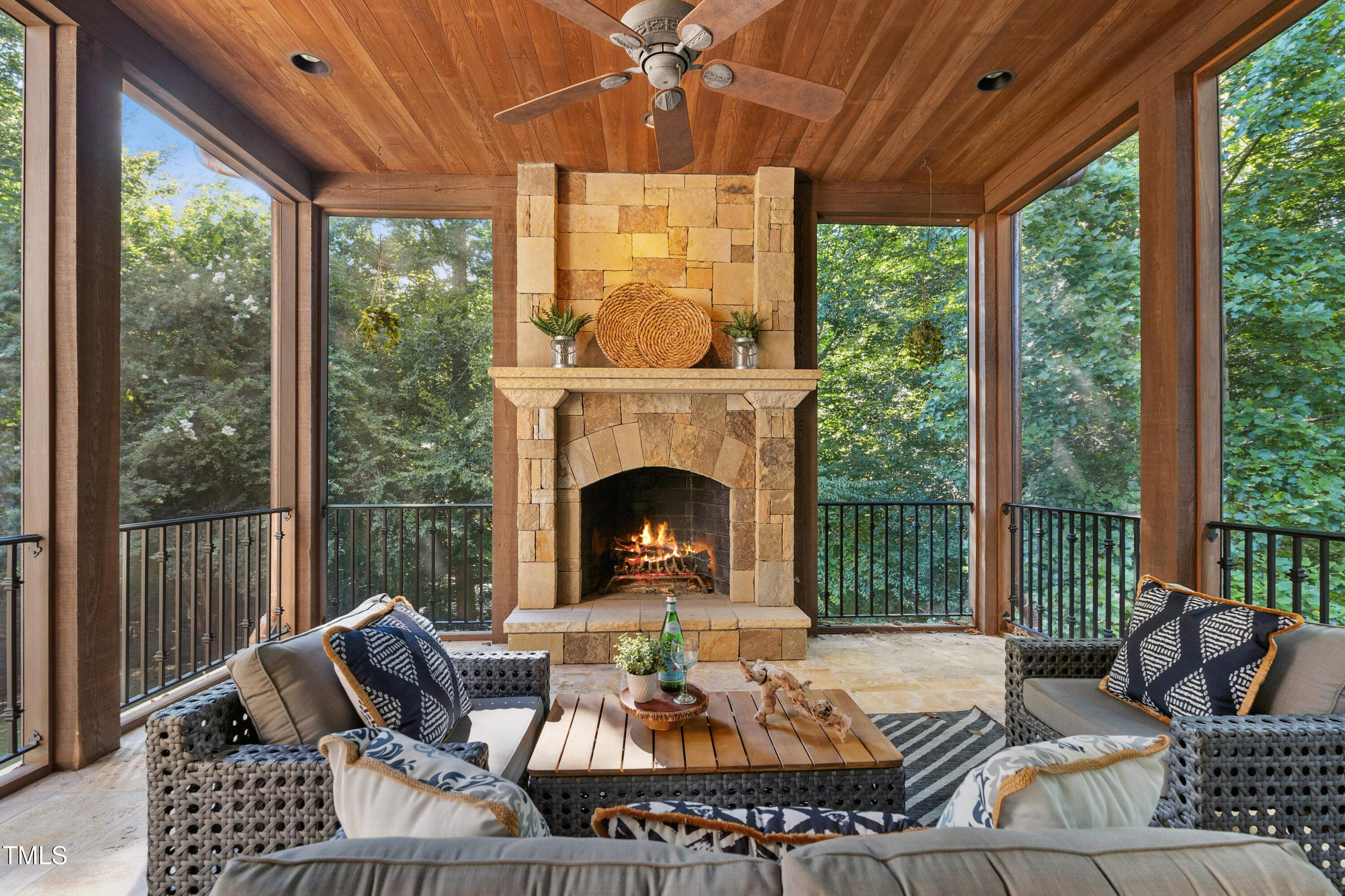 11213 Jonas Ridge Lane Raleigh, NC 27613 - Photo 25 of 91 a living room with furniture a fireplace and a floor to ceiling window