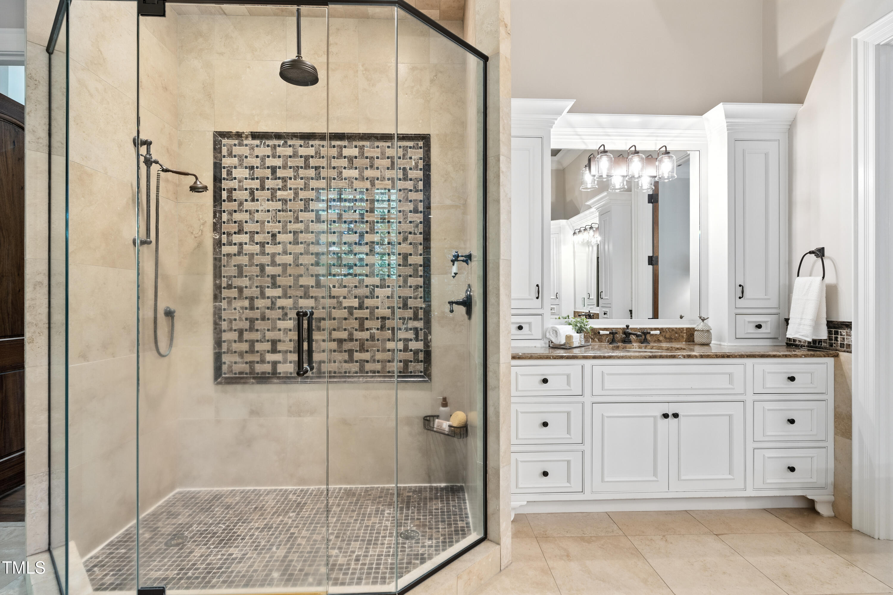 11213 Jonas Ridge Lane Raleigh, NC 27613 - Photo 39 of 91 a bathroom with a granite countertop sink a mirror and shower