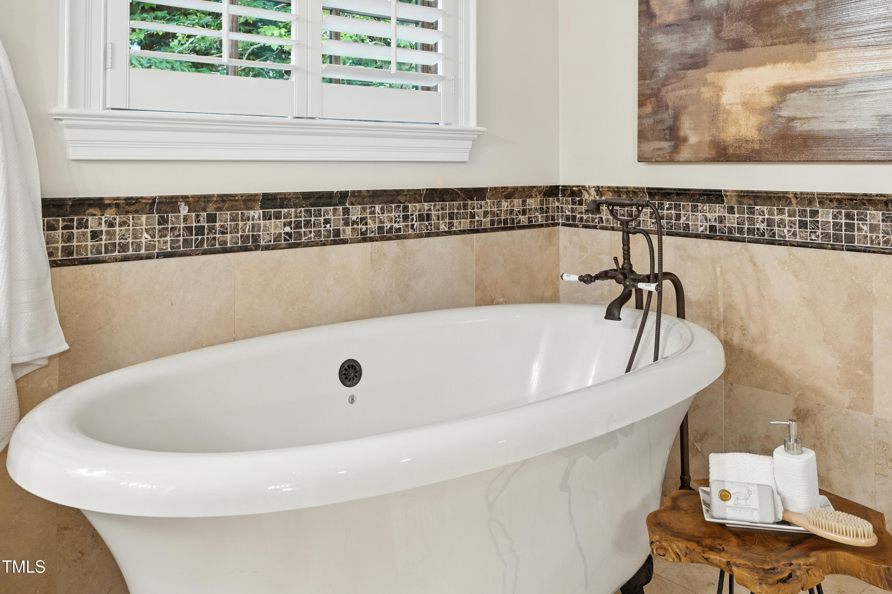 11213 Jonas Ridge Lane Raleigh, NC 27613 - Photo 41 of 91 a bathroom with a bathtub and a window