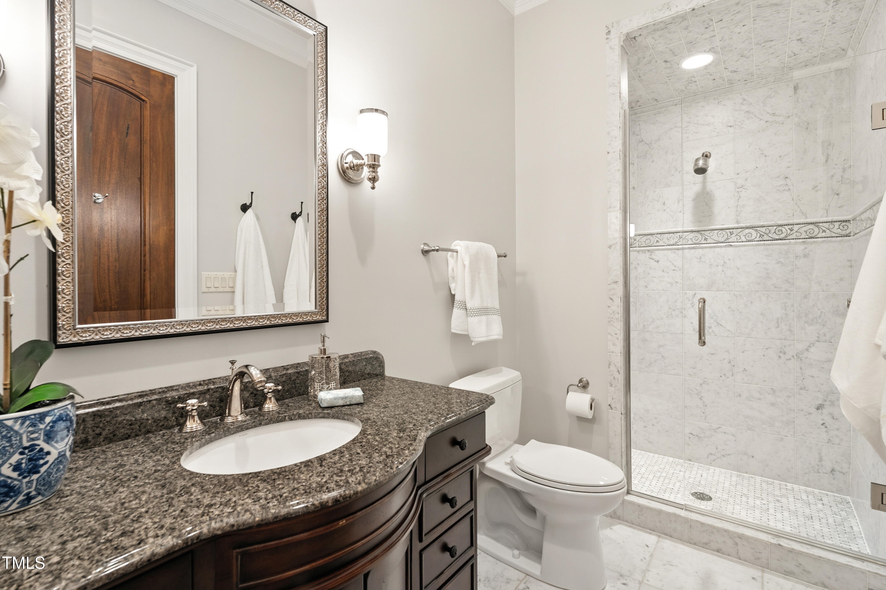 11213 Jonas Ridge Lane Raleigh, NC 27613 - Photo 45 of 91 a bathroom with a granite countertop sink toilet a mirror and shower