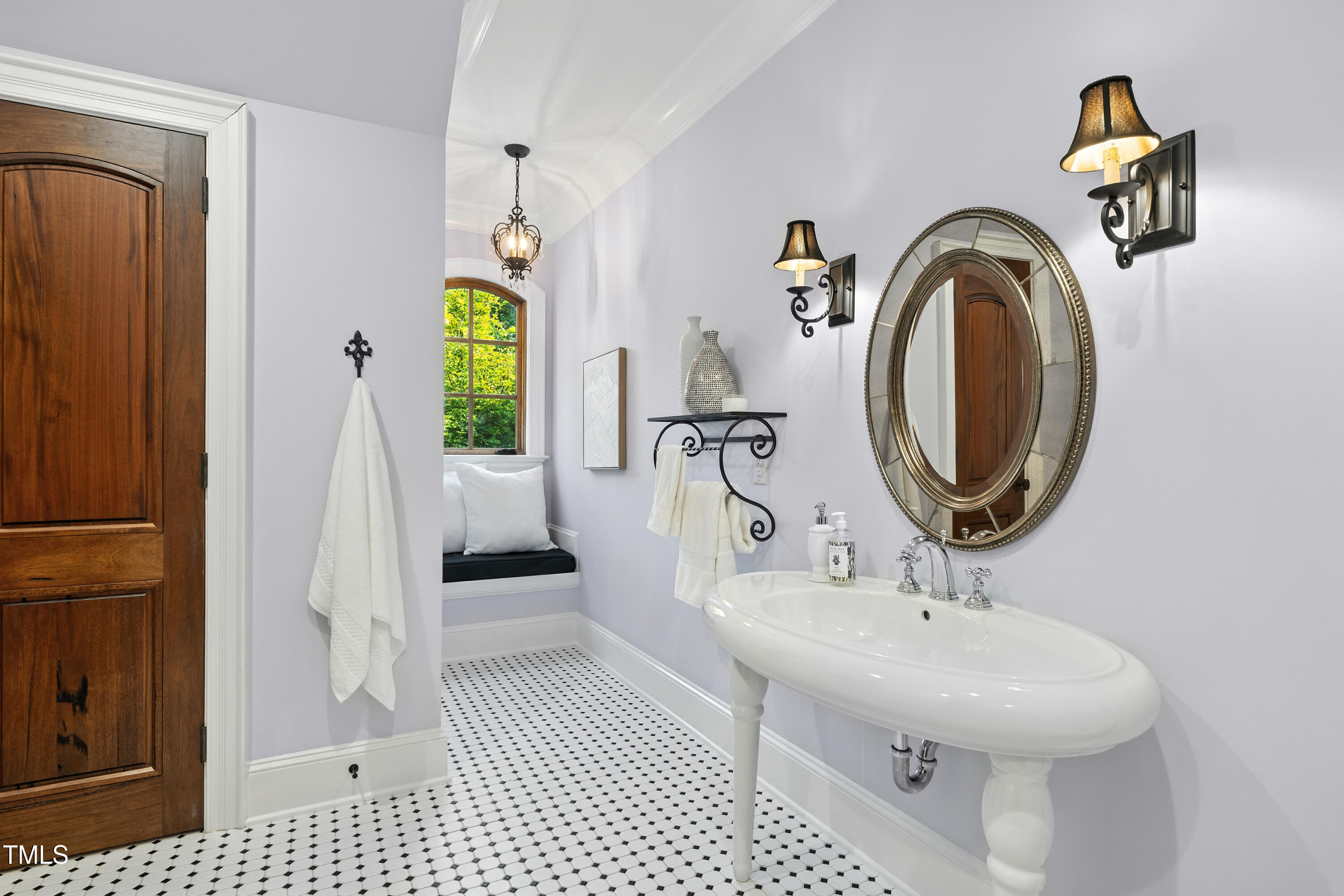 11213 Jonas Ridge Lane Raleigh, NC 27613 - Photo 52 of 91 a bathroom with a sink and a mirror