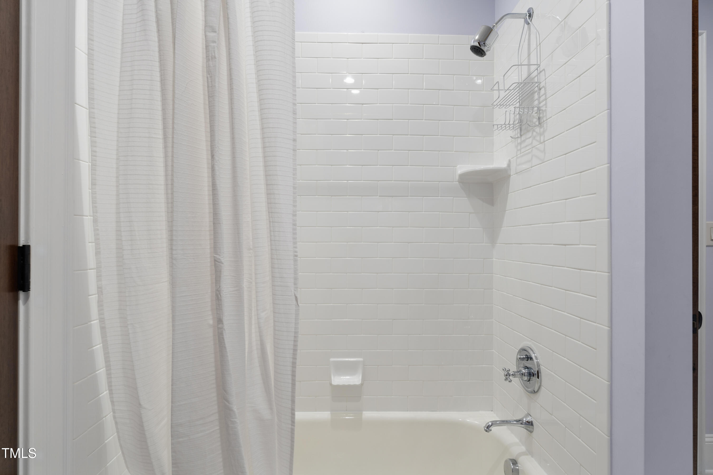 11213 Jonas Ridge Lane Raleigh, NC 27613 - Photo 53 of 91 a bathroom with a shower and a tub