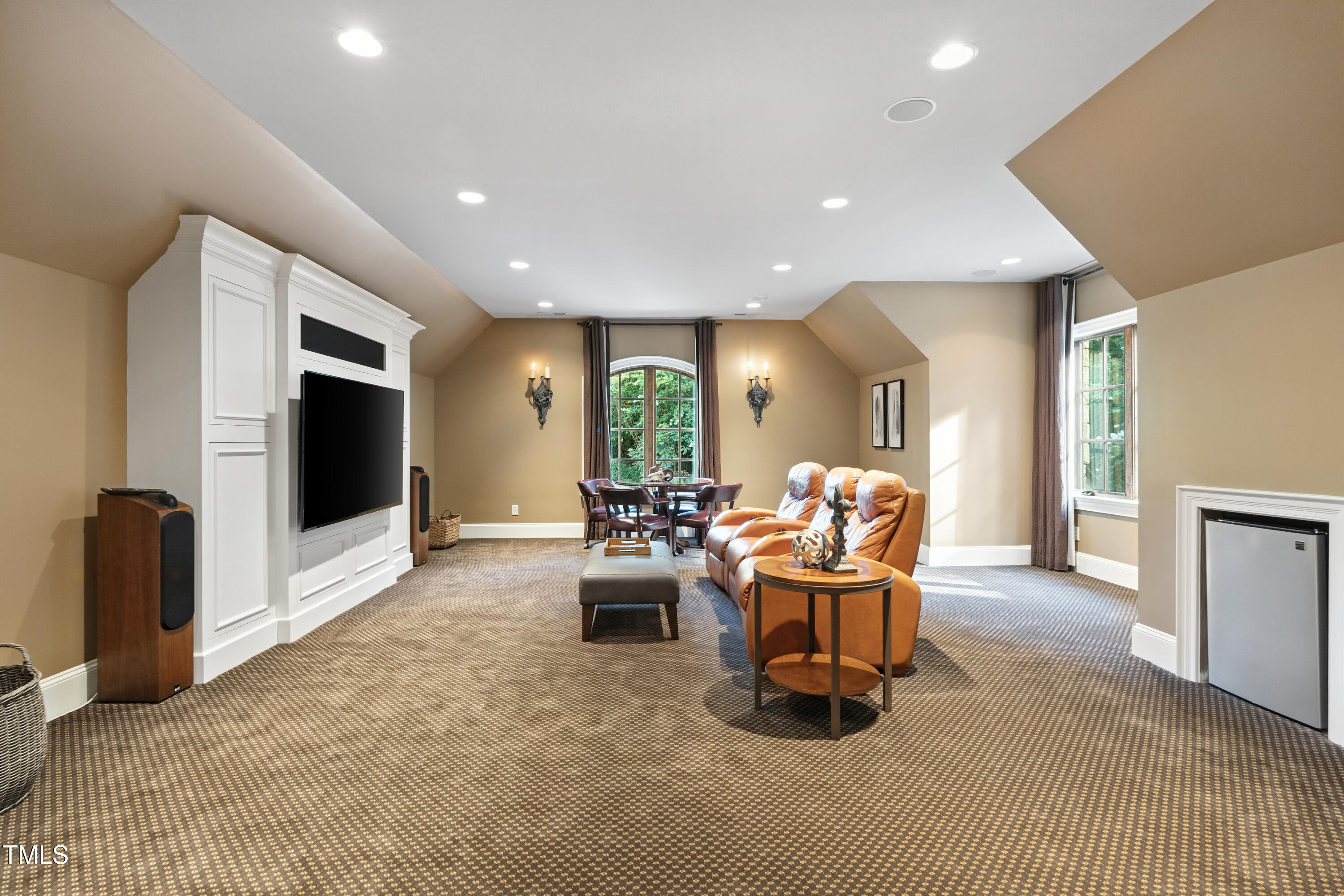 11213 Jonas Ridge Lane Raleigh, NC 27613 - Photo 54 of 91 a living room with furniture and a flat screen tv