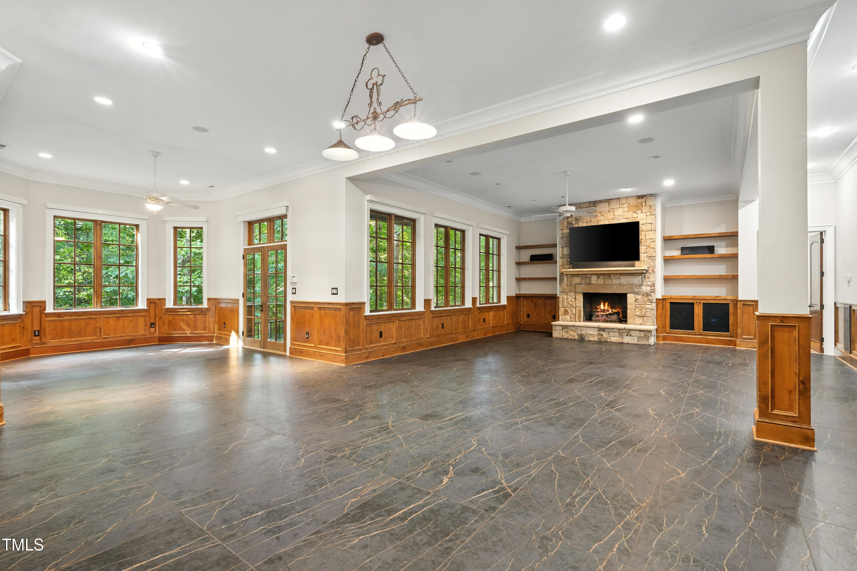 11213 Jonas Ridge Lane Raleigh, NC 27613 - Photo 57 of 91 a view of a livingroom with furniture a fireplace window and wooden floor