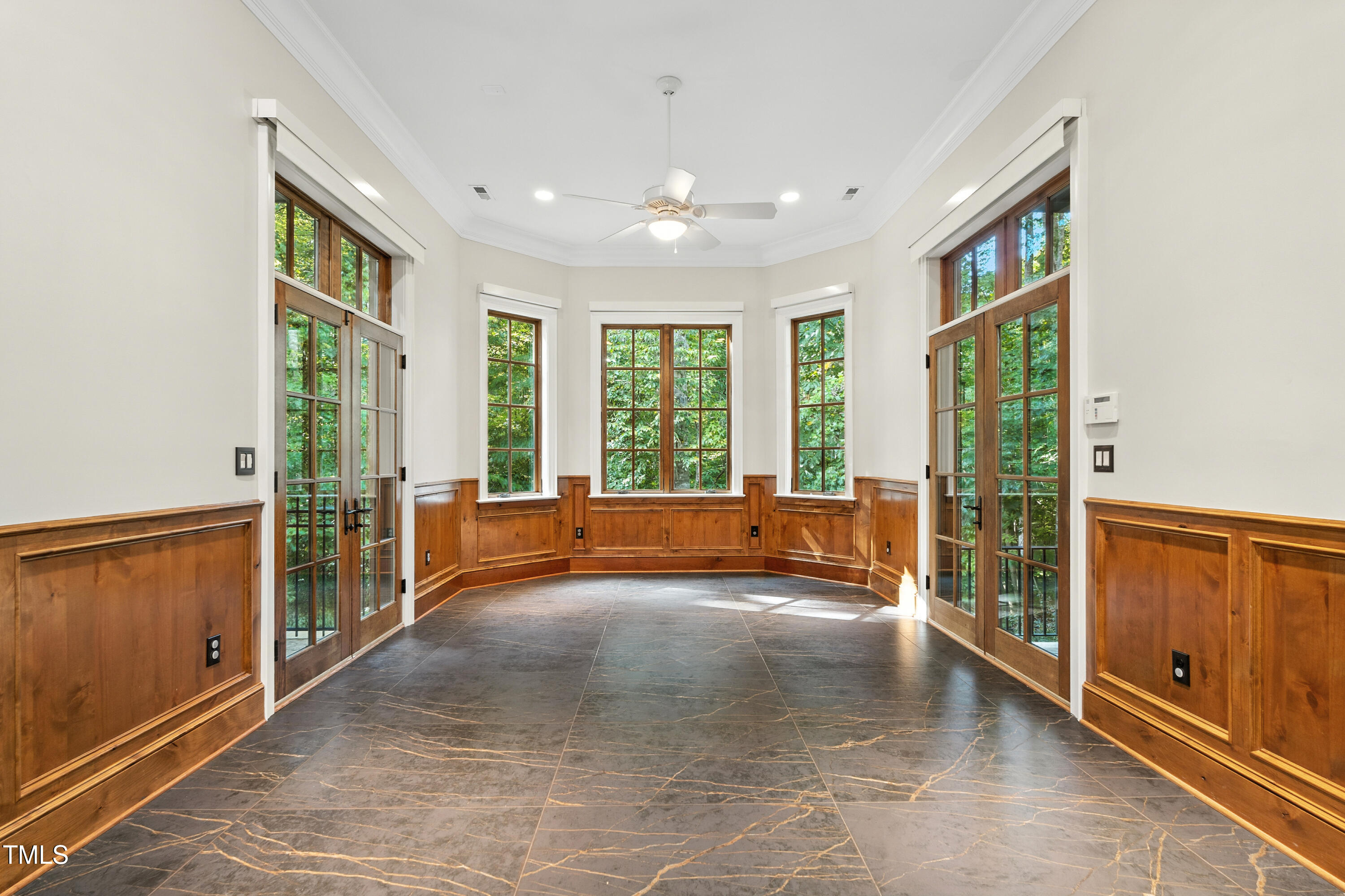 11213 Jonas Ridge Lane Raleigh, NC 27613 - Photo 58 of 91 a view of an empty room with wooden floor and a window