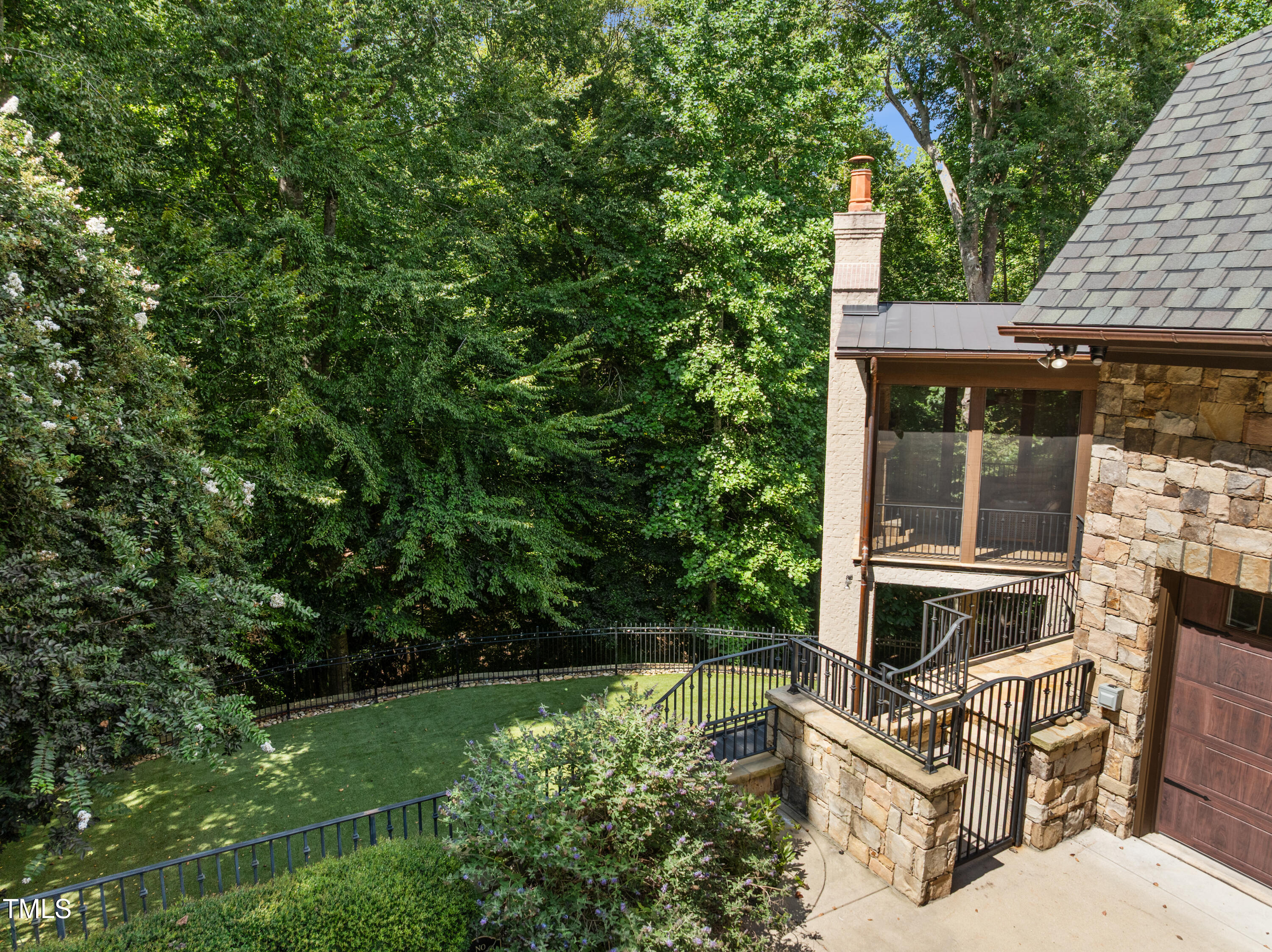 11213 Jonas Ridge Lane Raleigh, NC 27613 - Photo 69 of 91 a backyard of a house with table and chairs