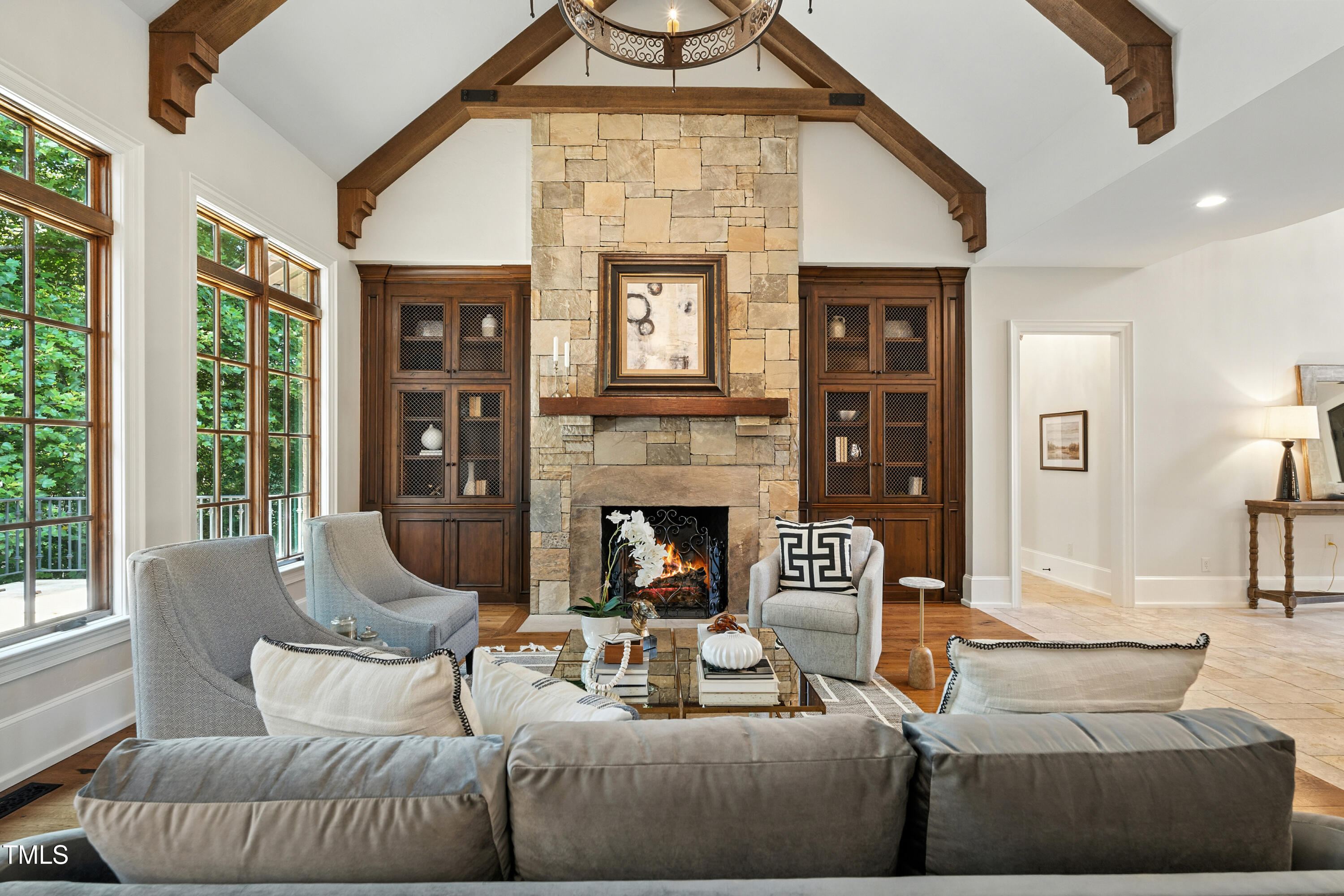 11213 Jonas Ridge Lane Raleigh, NC 27613 - Photo 7 of 91 a living room with furniture a fireplace and a large window