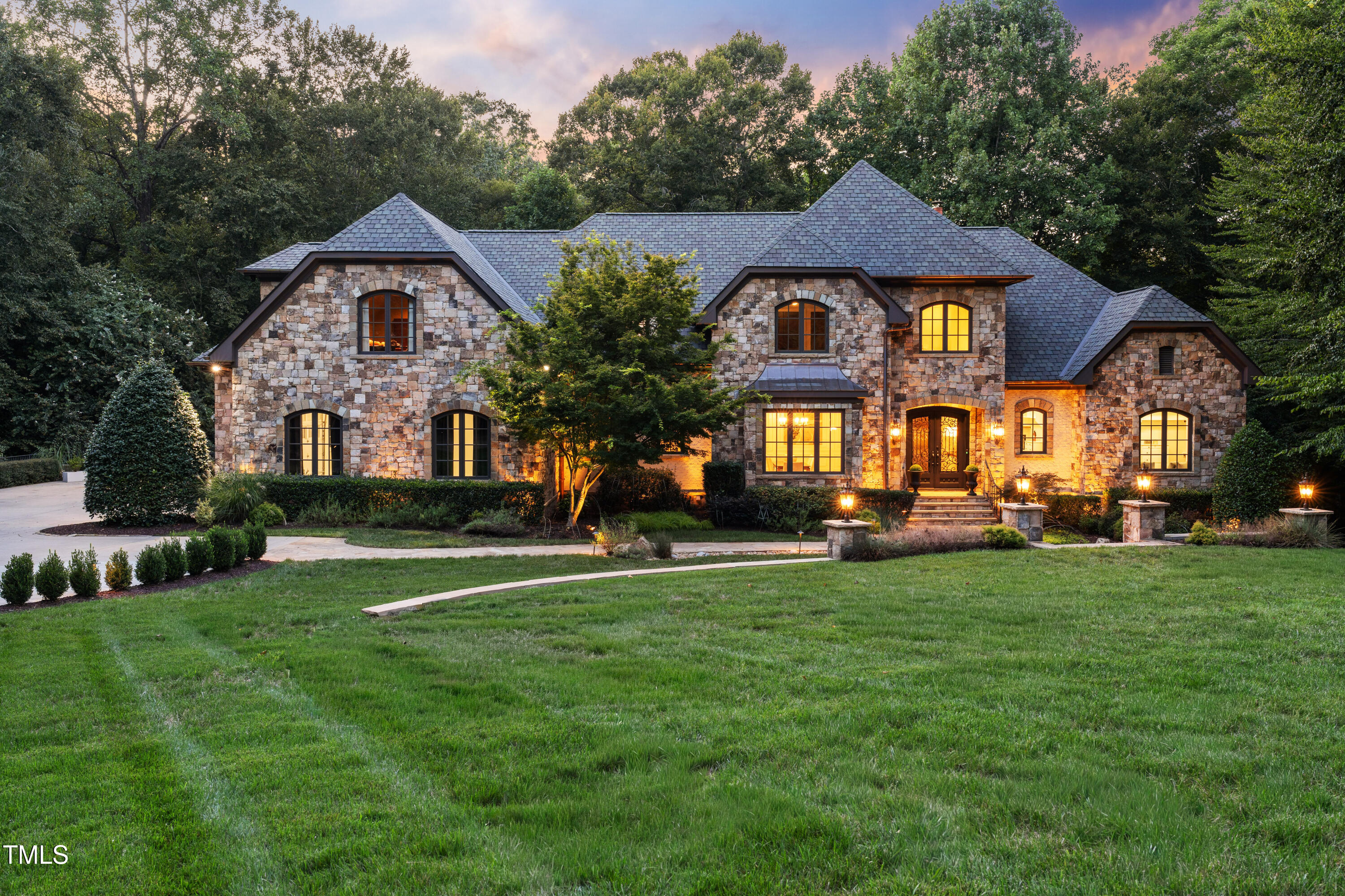 11213 Jonas Ridge Lane Raleigh, NC 27613 - Photo 85 of 91 a front view of a house with a garden