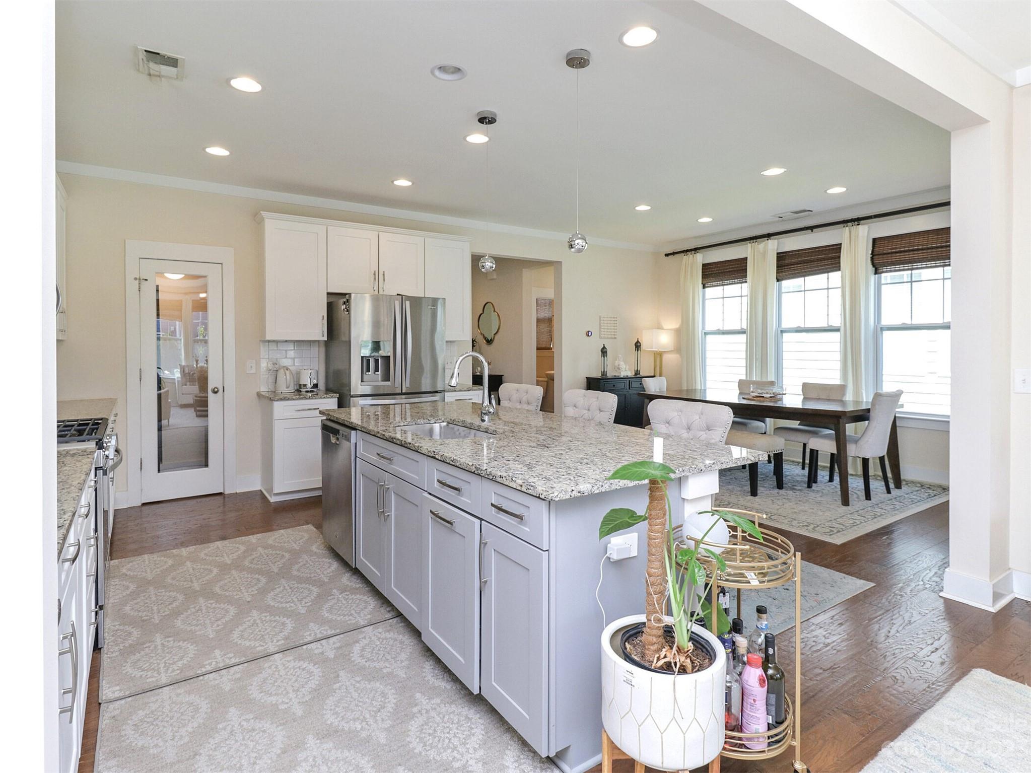 2634 Double Oaks Road Charlotte, NC 28206 - Photo 17 of 48 a kitchen with kitchen island granite countertop lots of counter top space