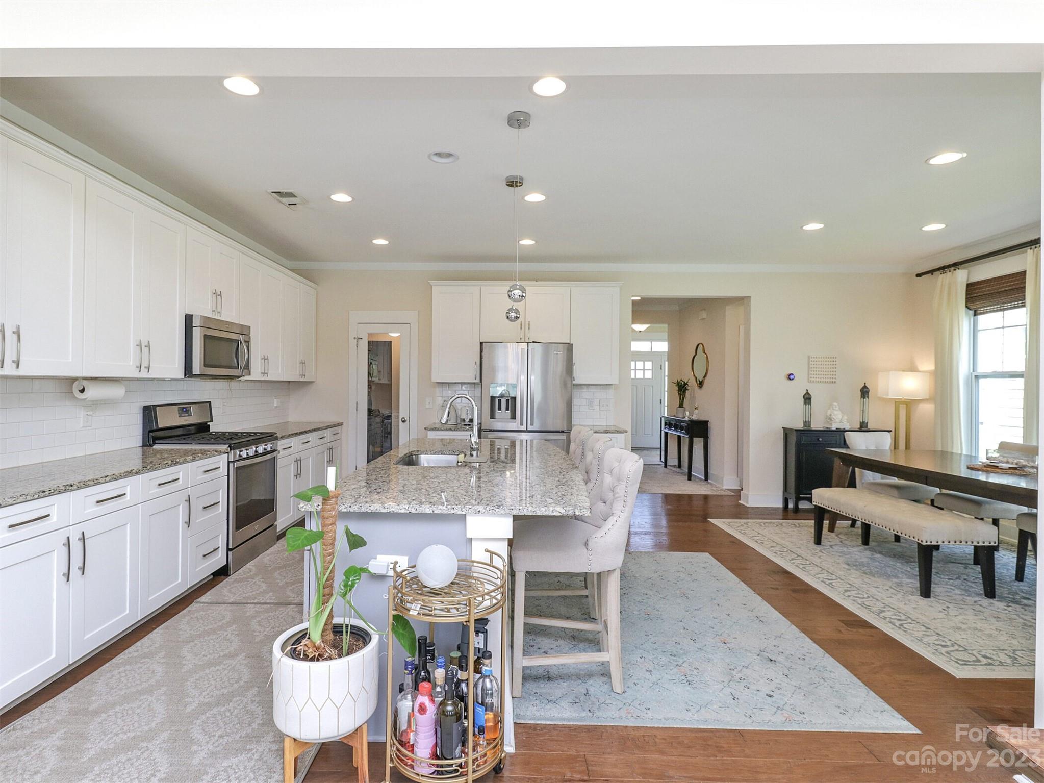 2634 Double Oaks Road Charlotte, NC 28206 - Photo 18 of 48 a large kitchen with a table and chairs