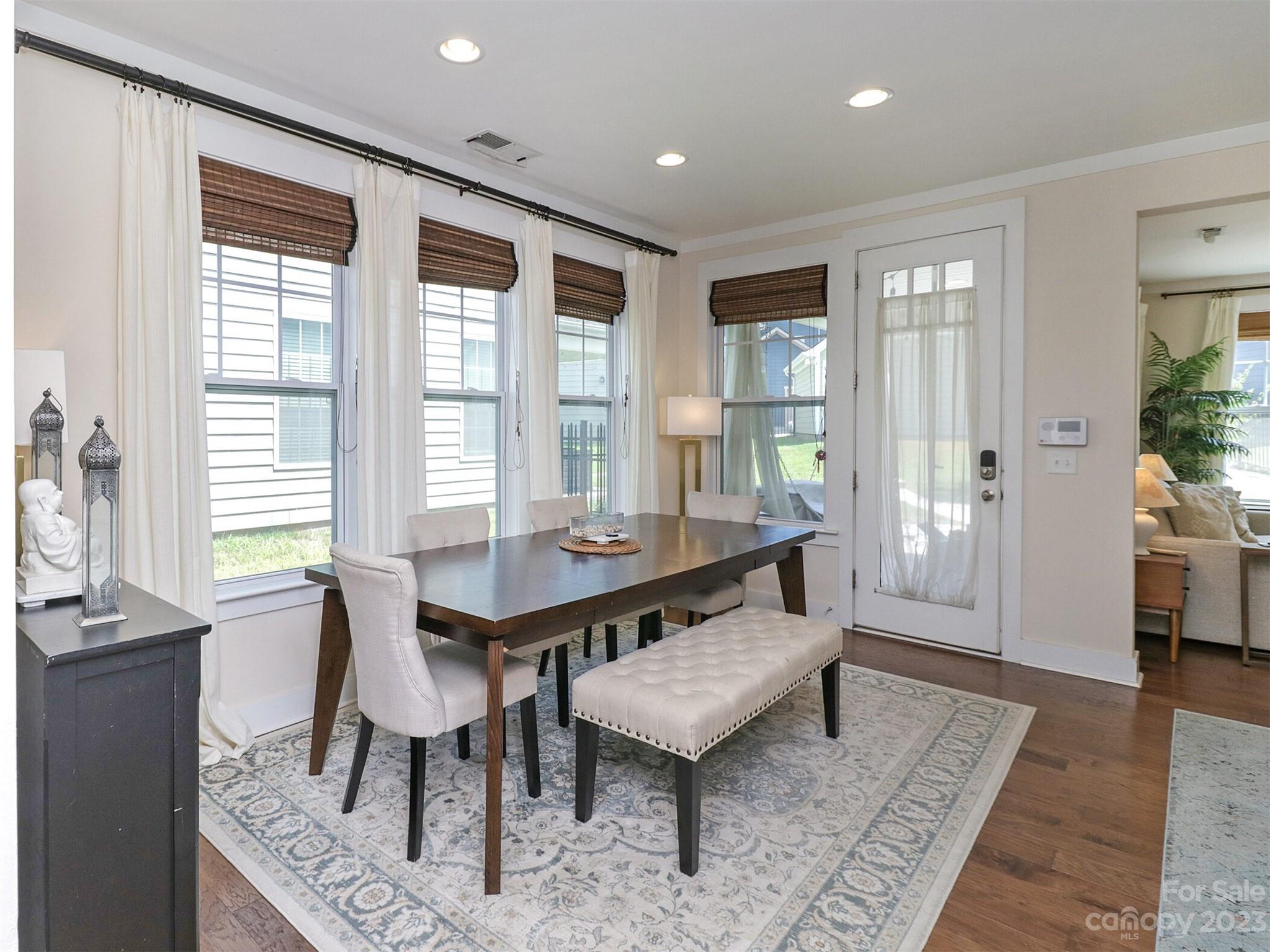 2634 Double Oaks Road Charlotte, NC 28206 - Photo 21 of 48 a view of a dining room with furniture window and wooden floor