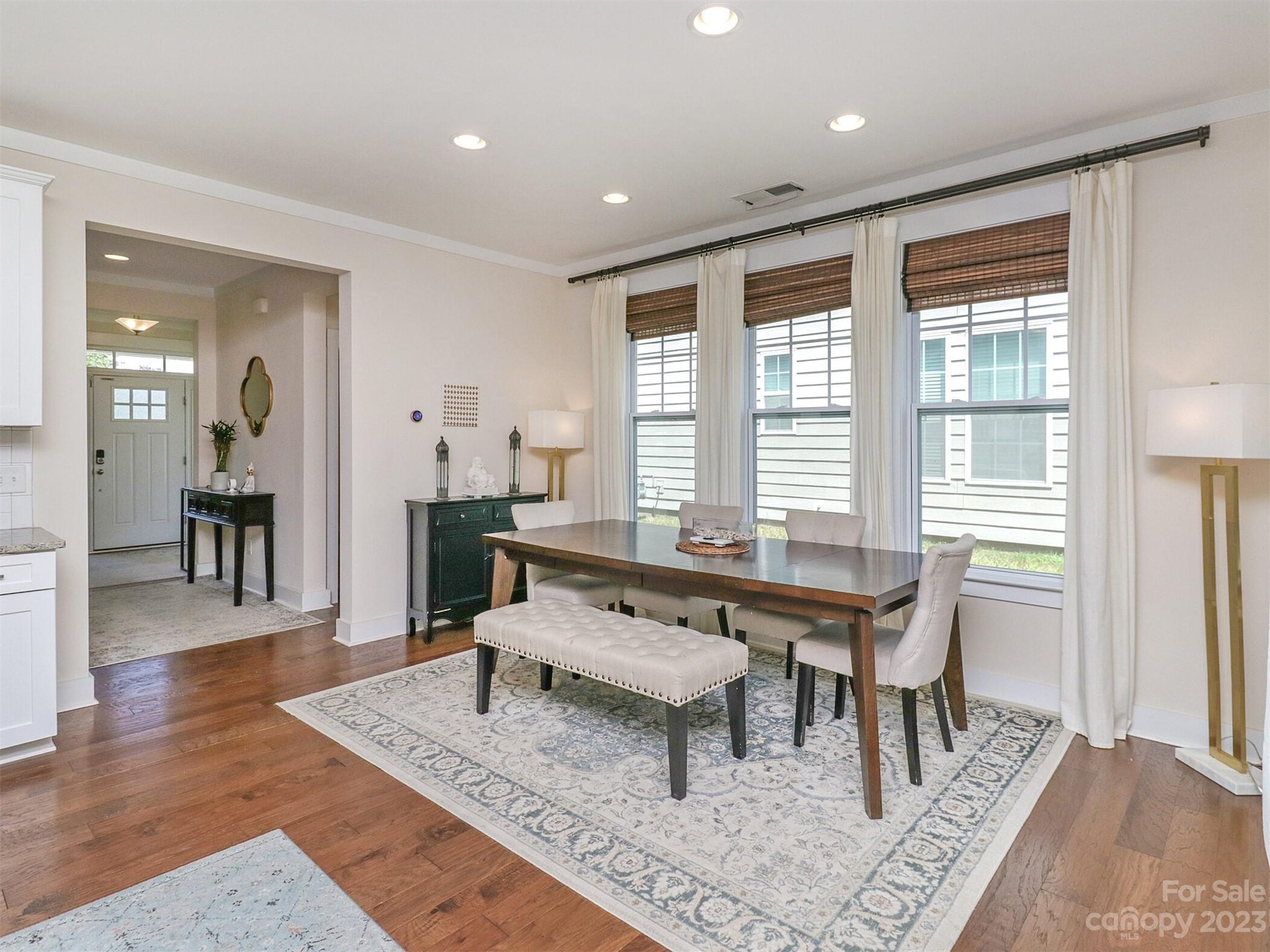 2634 Double Oaks Road Charlotte, NC 28206 - Photo 22 of 48 a living room with furniture a wooden floor and a table
