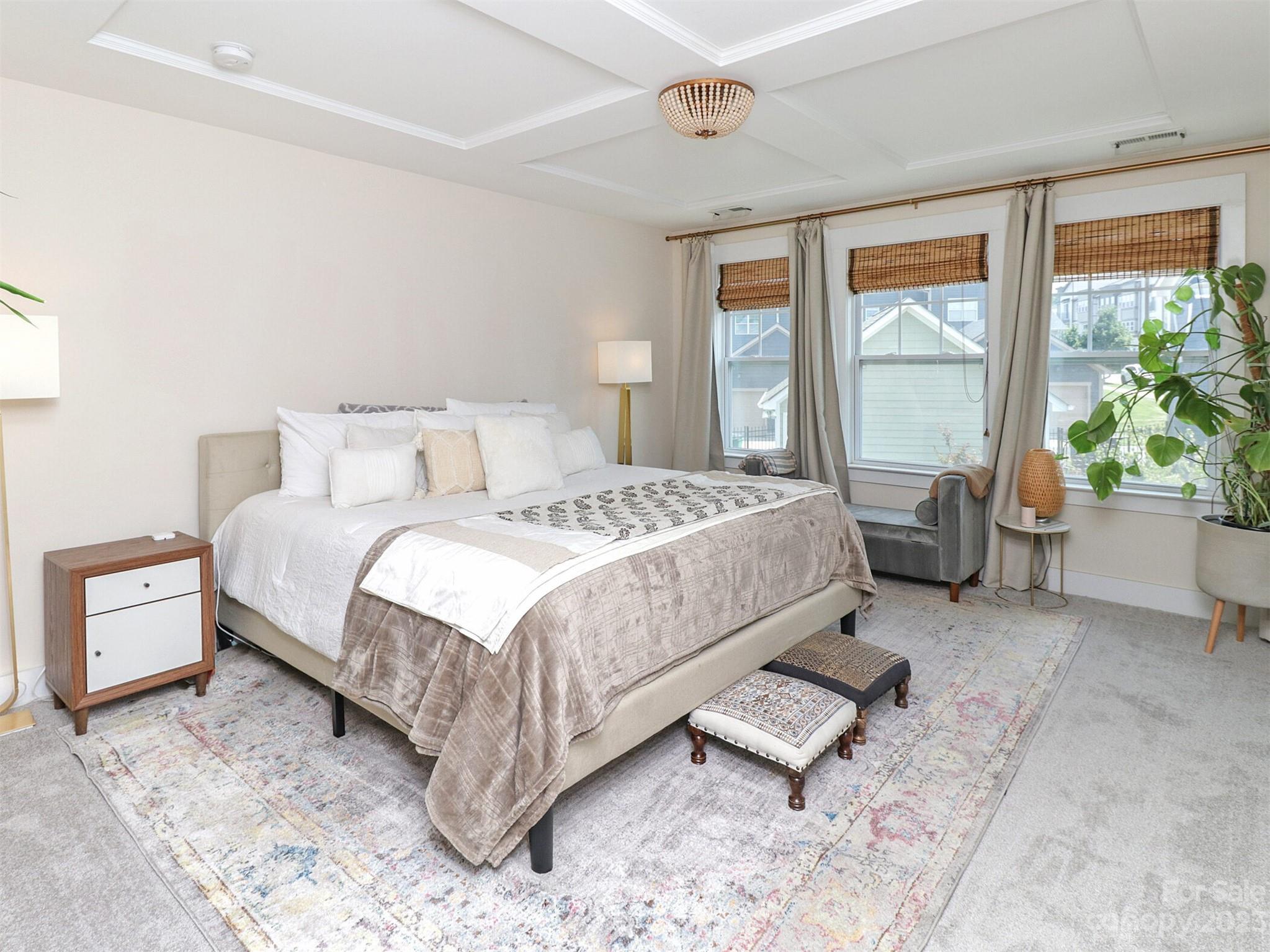 2634 Double Oaks Road Charlotte, NC 28206 - Photo 25 of 48 a spacious bedroom with a bed and glass window