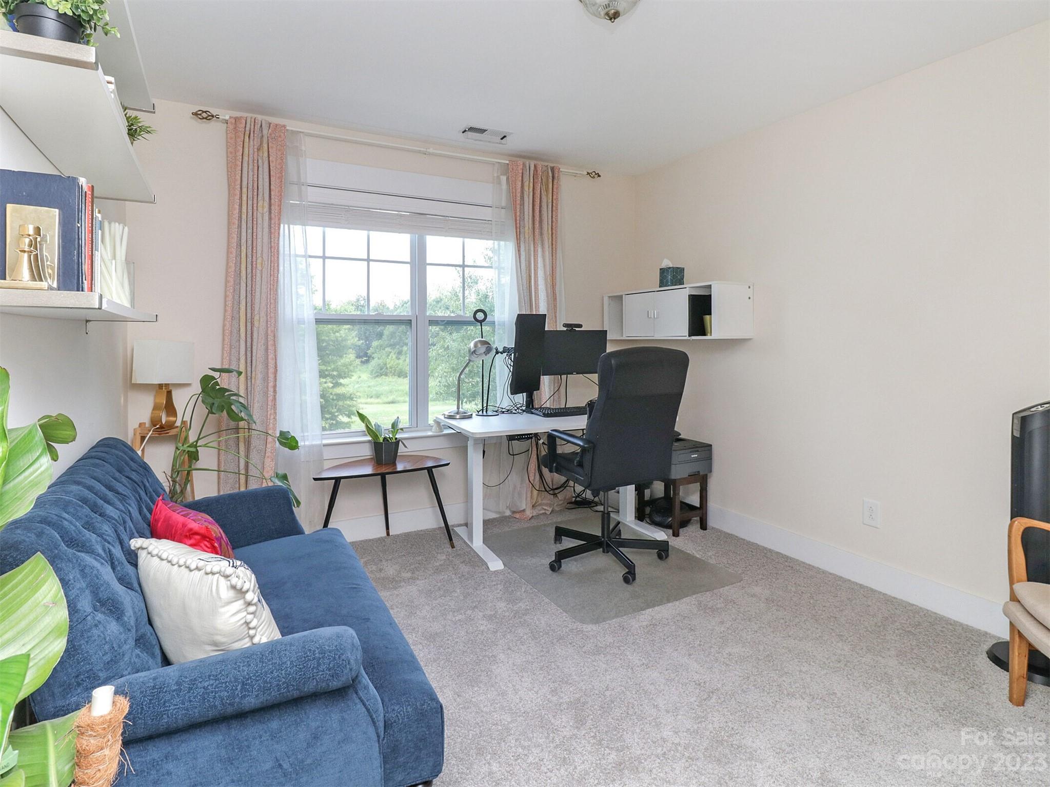 2634 Double Oaks Road Charlotte, NC 28206 - Photo 33 of 48 a living room with furniture and a window