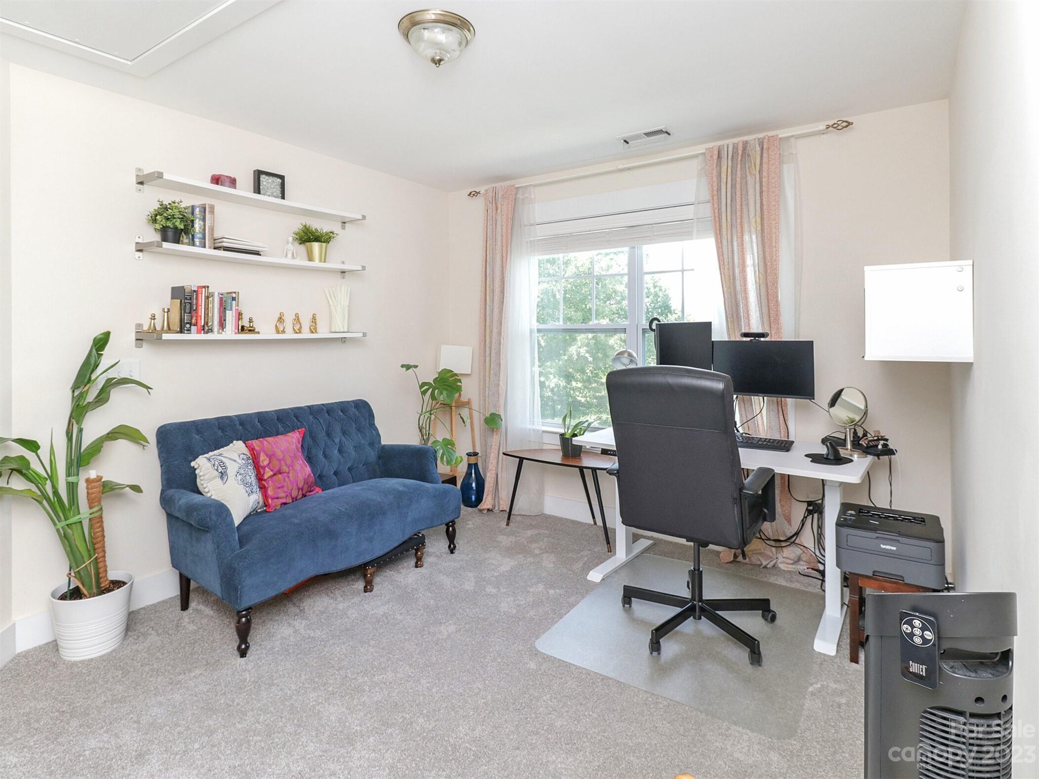 2634 Double Oaks Road Charlotte, NC 28206 - Photo 34 of 48 a living room with furniture and a window