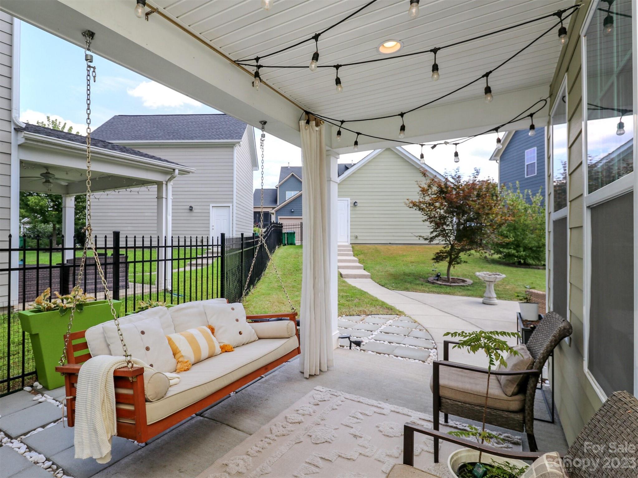 2634 Double Oaks Road Charlotte, NC 28206 - Photo 36 of 48 a view of a porch with furniture and a yard
